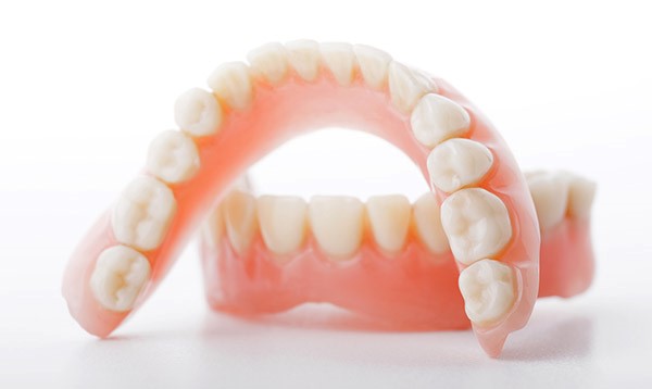 A 3D model of a set of dentures, showcasing the artificial teeth and gums.